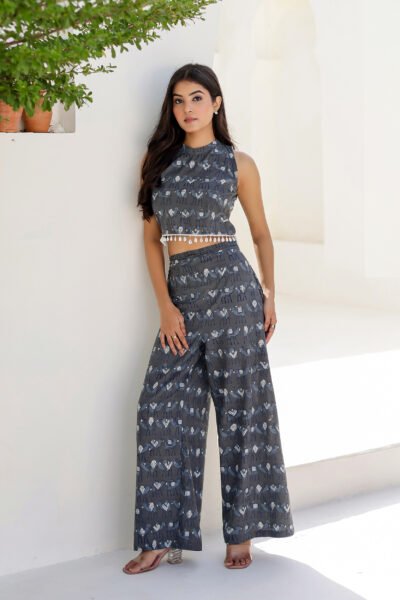 Model wearing Bolbo Midnight Muse gray camel print coord set featuring sleeveless crop top and wide-leg pants – front view.